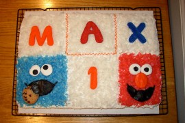 sheet cake with elmo and cookie monster made from dyed coconut