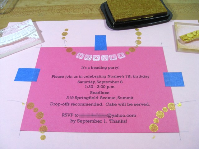 picture of invitation with rubber stamps applied to create gold round beads and white alphabet beads.