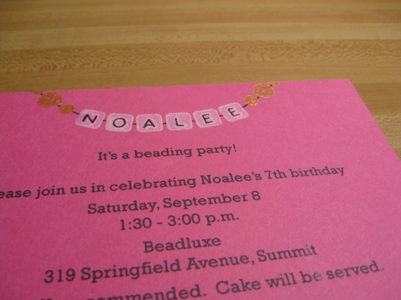 Close photo of invitation that shows glossy heat-embossed effect