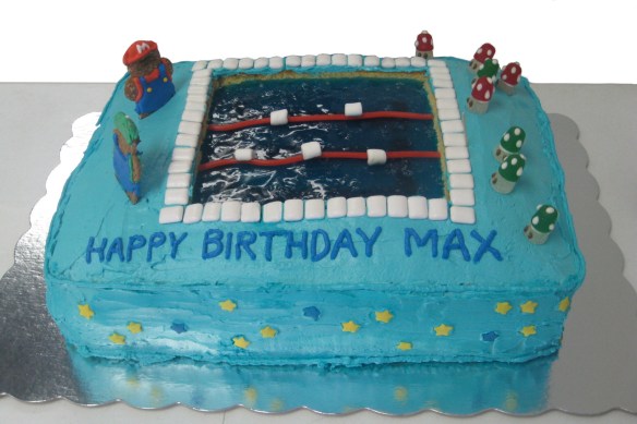 Super Mario decorated sheet cake with Jell-o swimming pool in middle