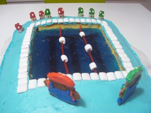 Close up of a Jell-o "pool" inset into a vanilla sheet cake.